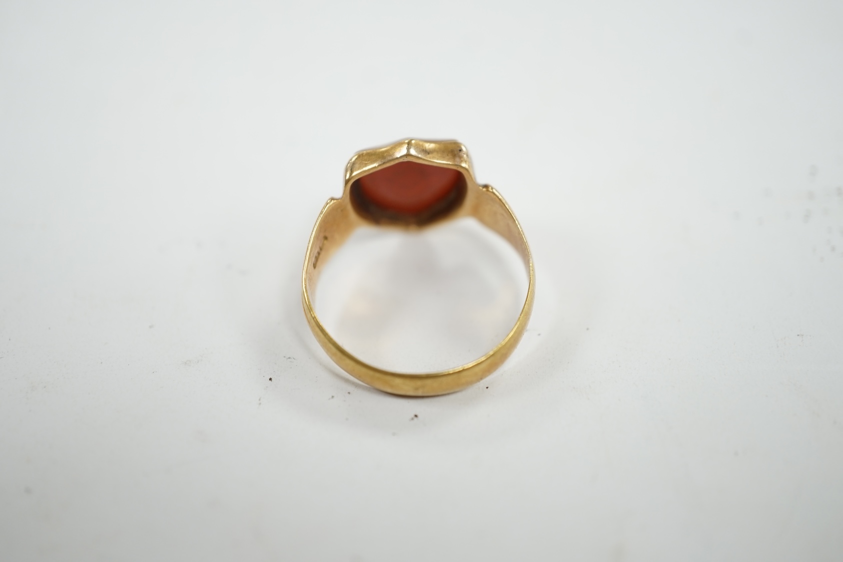 A late Victorian 18ct gold and sardonyx set shield shaped Masonic signet ring, size Q/R, gross weight 5 grams. Condition - fair